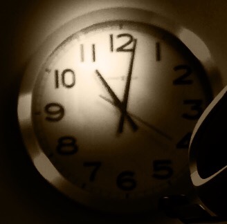 Photo of a clock showing 11 o'clock