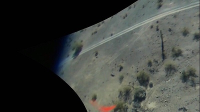 Photo taken from falling drone showing a propellor fragment (red at bottom of image) from motor number two
